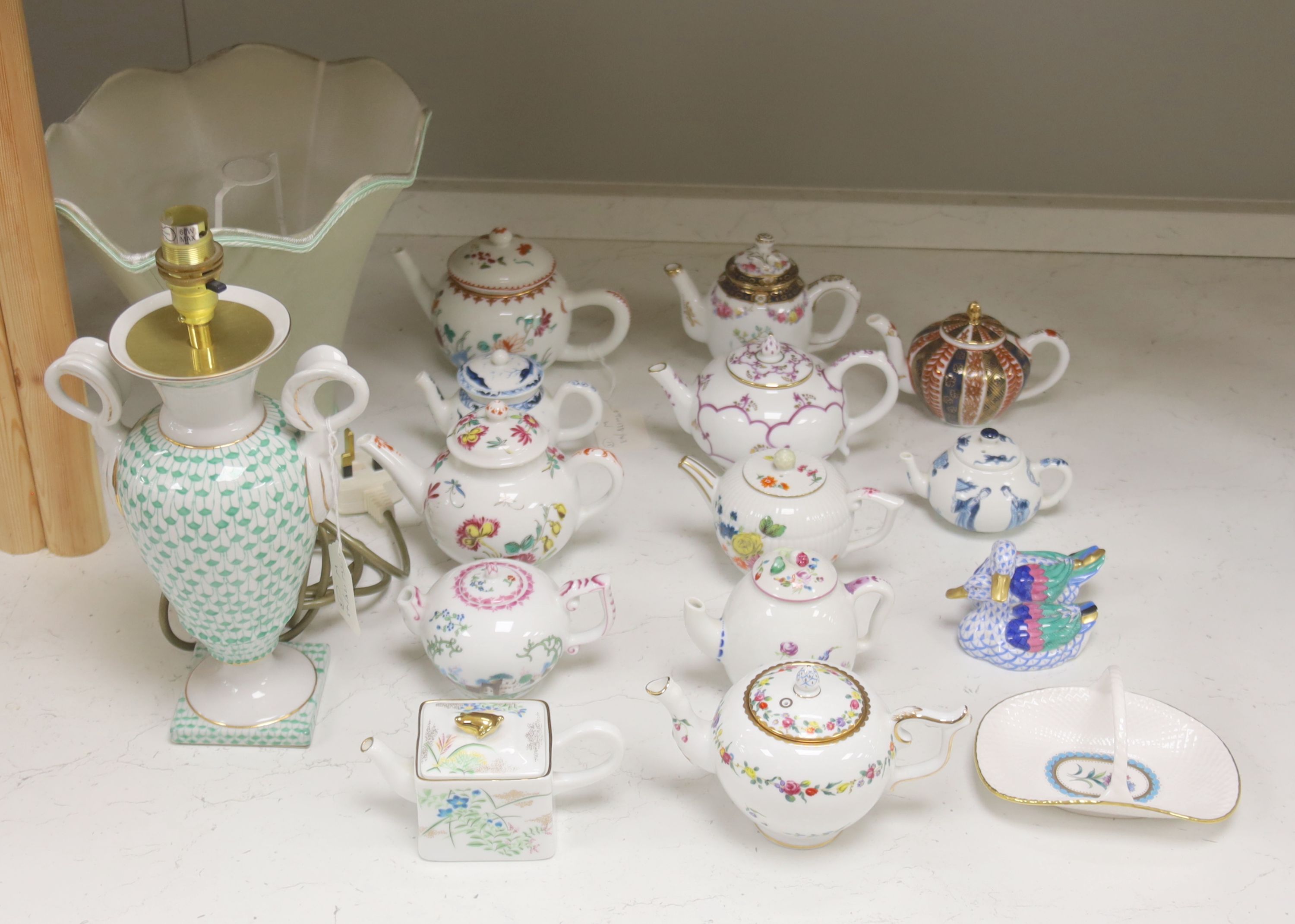 Twelve modern floral-decorated collectors' teapots (V&A Museum Collection), a Spode dish, a table lamp and a Herend duck group (15)